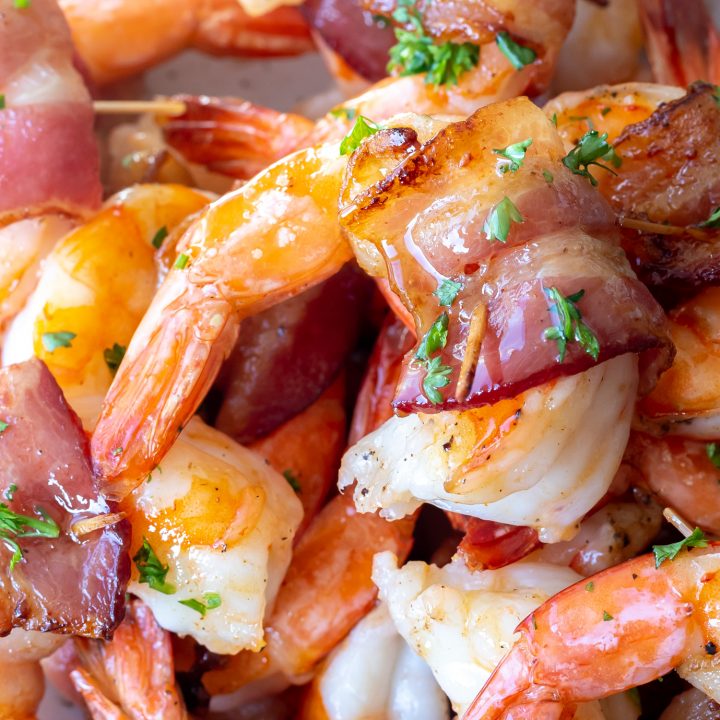 cooked shrimp with bacon sprinkled with chopped parsley