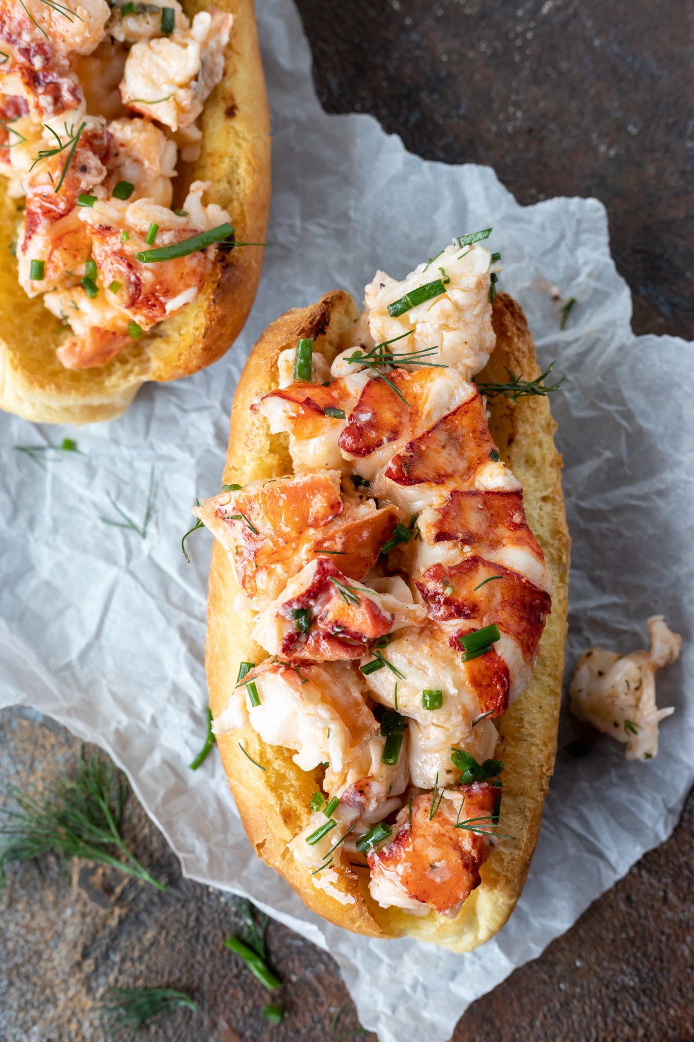 prepared lobster rolls on parchment paper