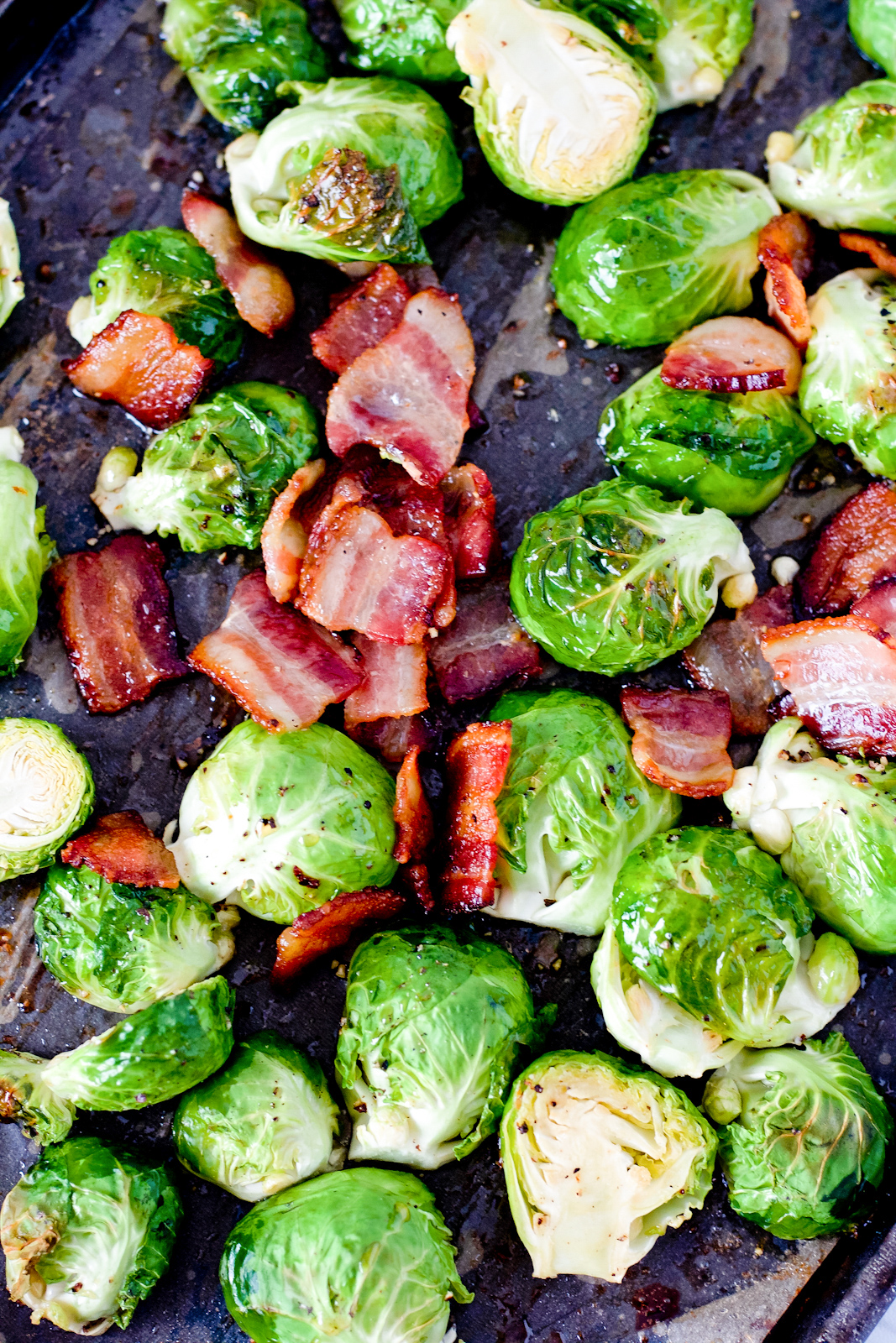 brussels sprouts and bacon on baking sheet