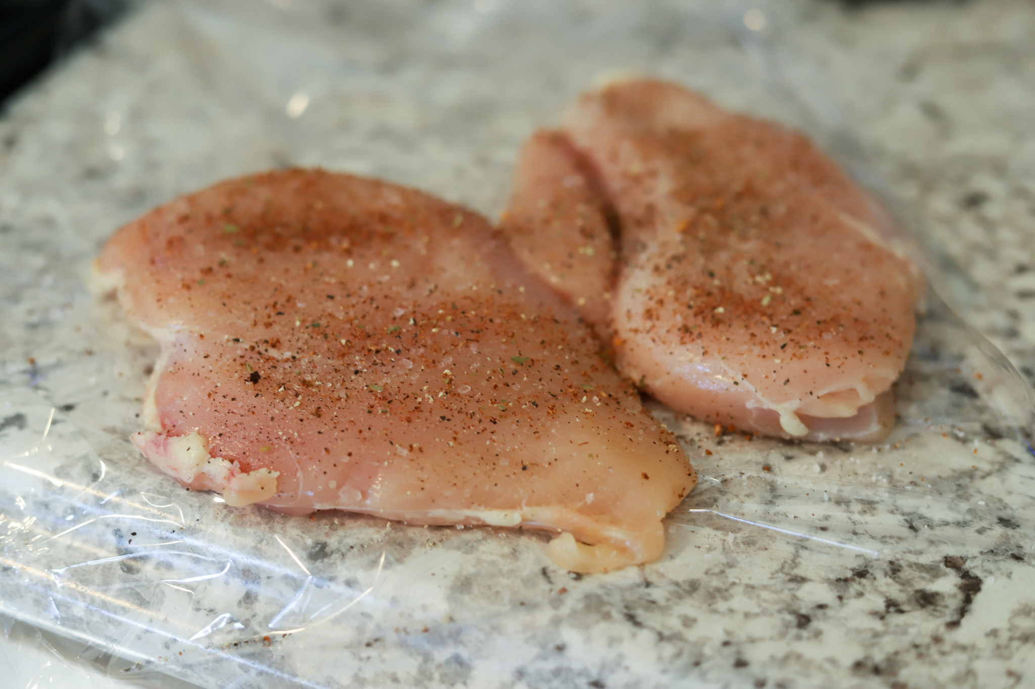 raw chicken breasts on counter