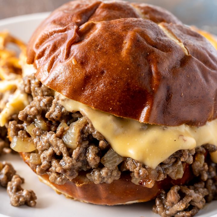 loose meat and cheese sauce served on pretzel roll