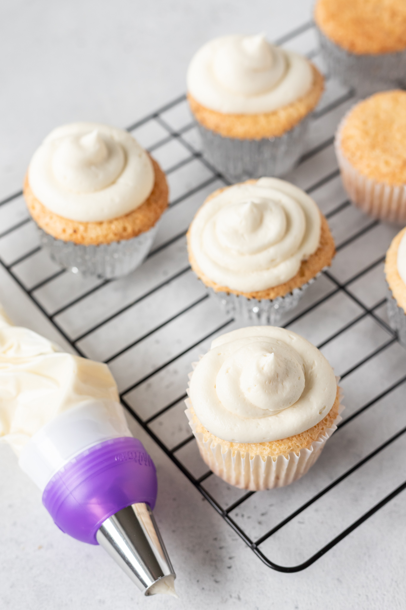 piping bag next to cupcakes
