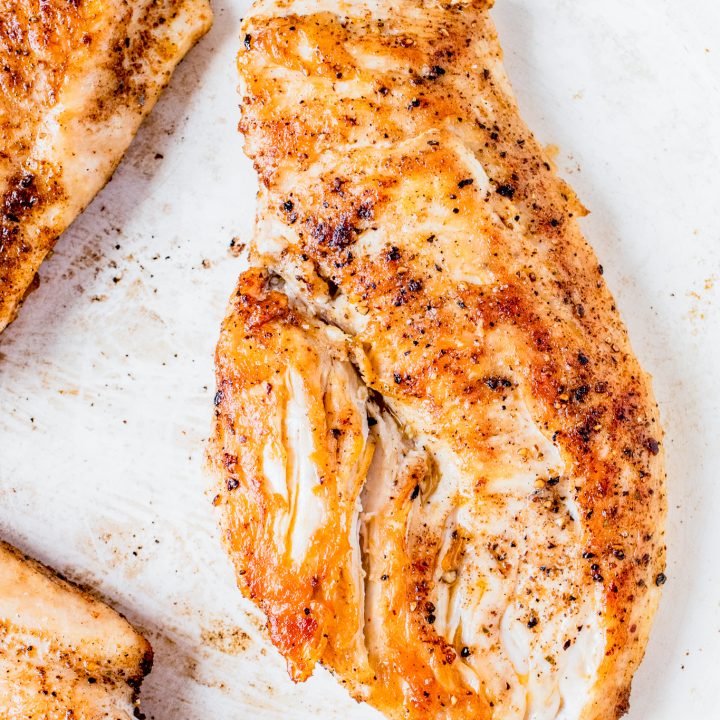 golden brown chicken breast in pan