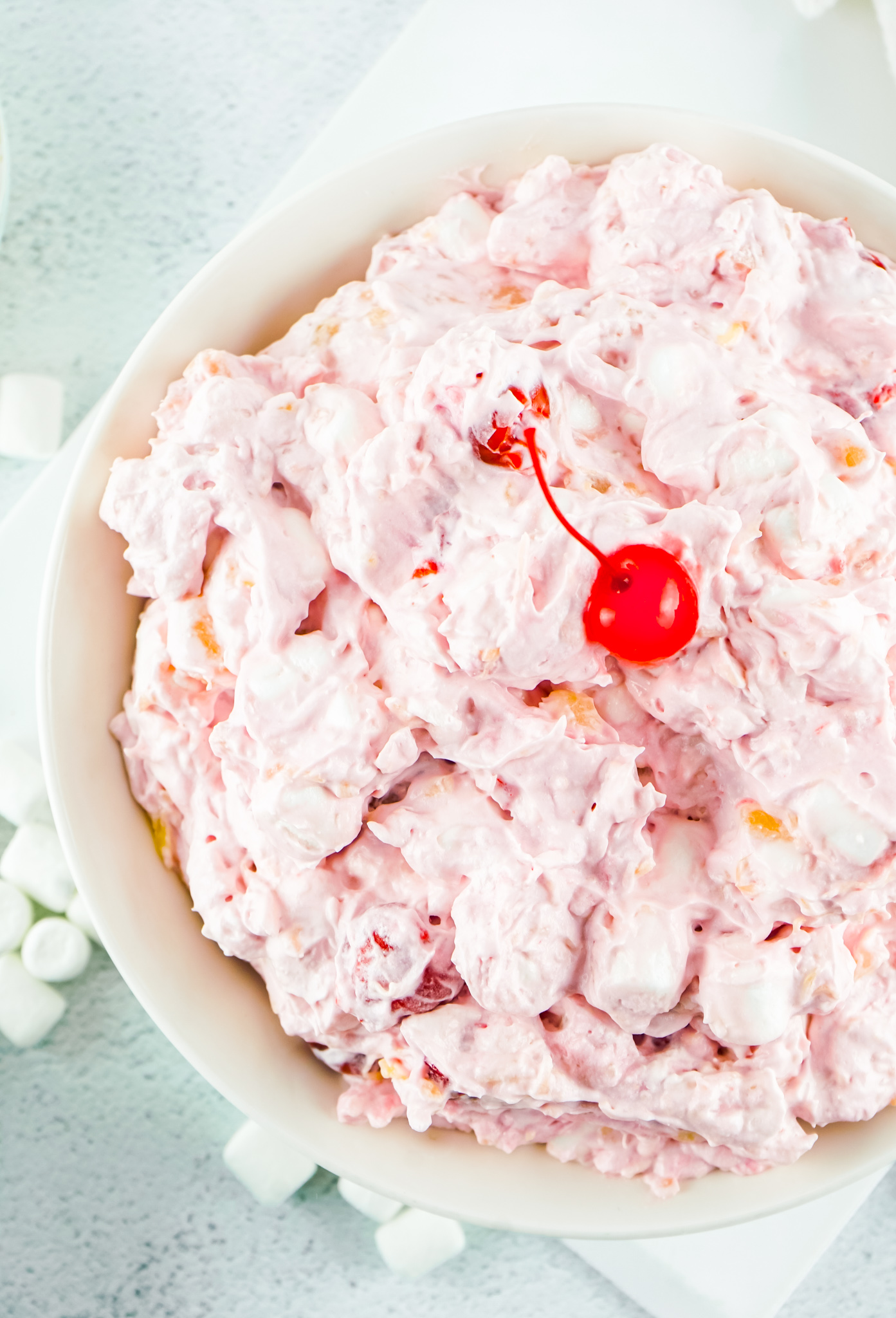 creamy pink mixture topped with a cherry