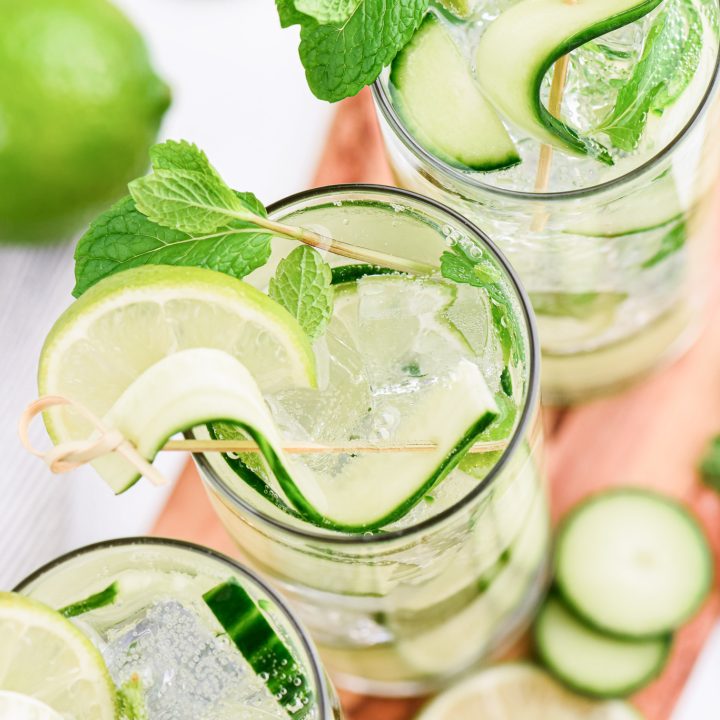 three glasses filled with mojitos