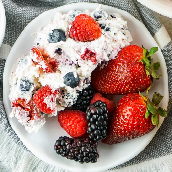 fluff salad served on white plate with berries