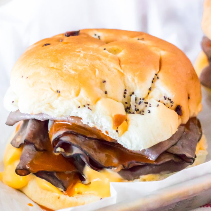thin roast beef, sauce and cheese layered in-between soft buns