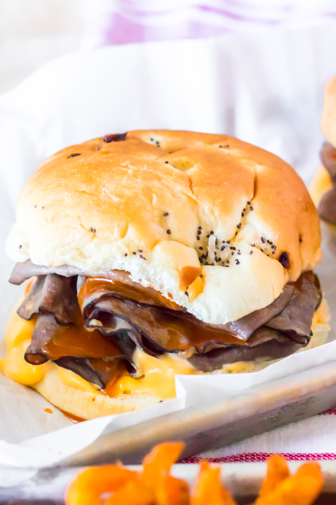 thin roast beef, sauce and cheese layered in-between soft buns