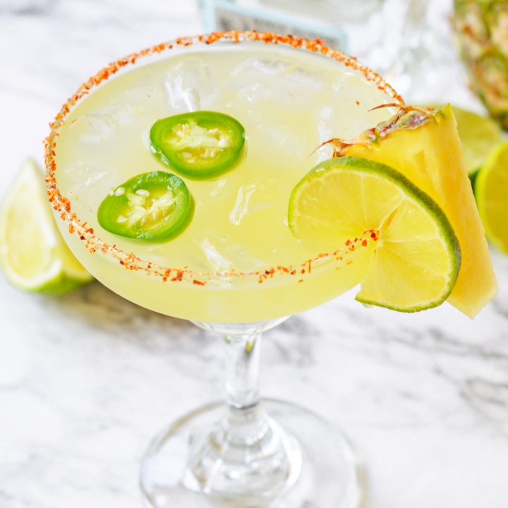 yellow cocktail in margarita glass