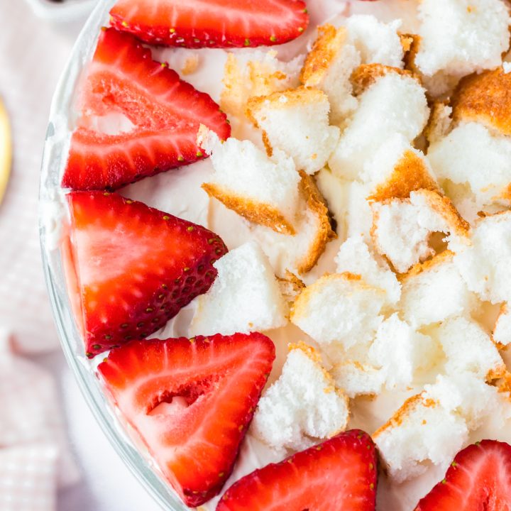 sliced strawberries and cake pieces in dish