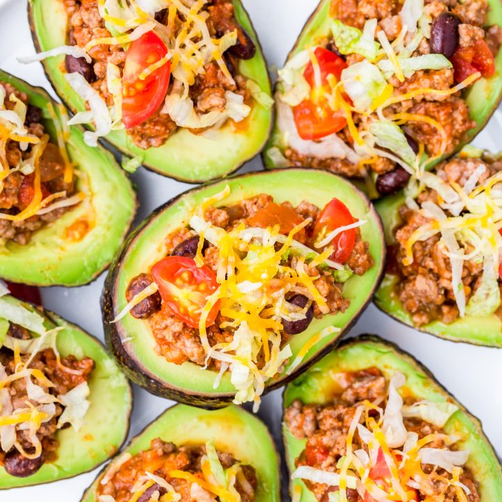 prepared avocados on white platter