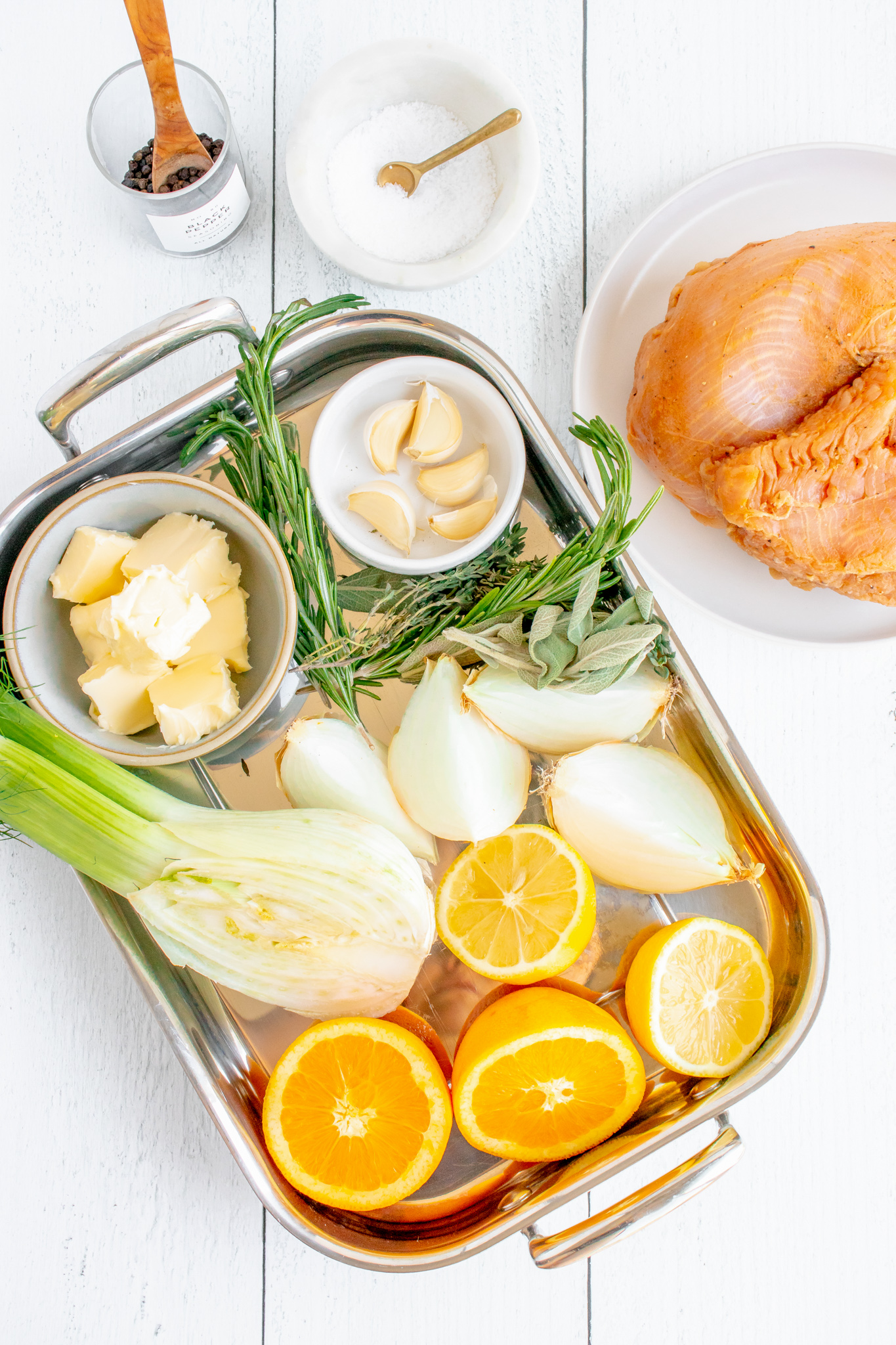 ingredients in roasting pan, turkey on the side