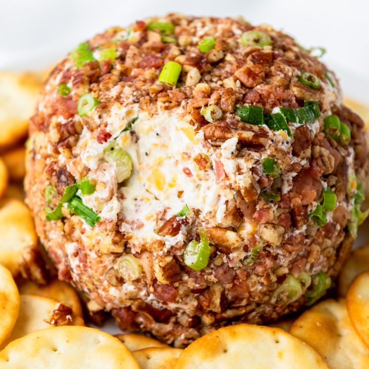 partially eaten cheese ball with crackers