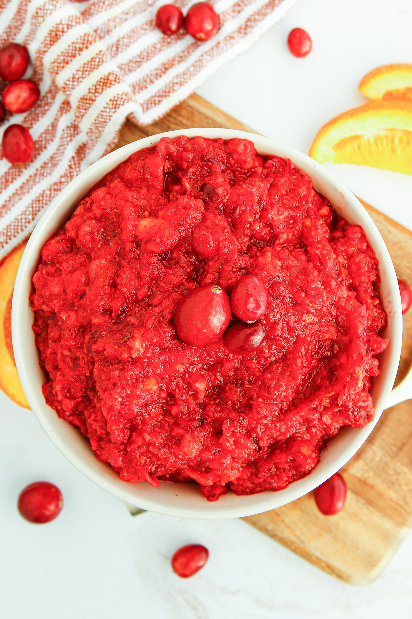 relish topped with cranberries served in bowl