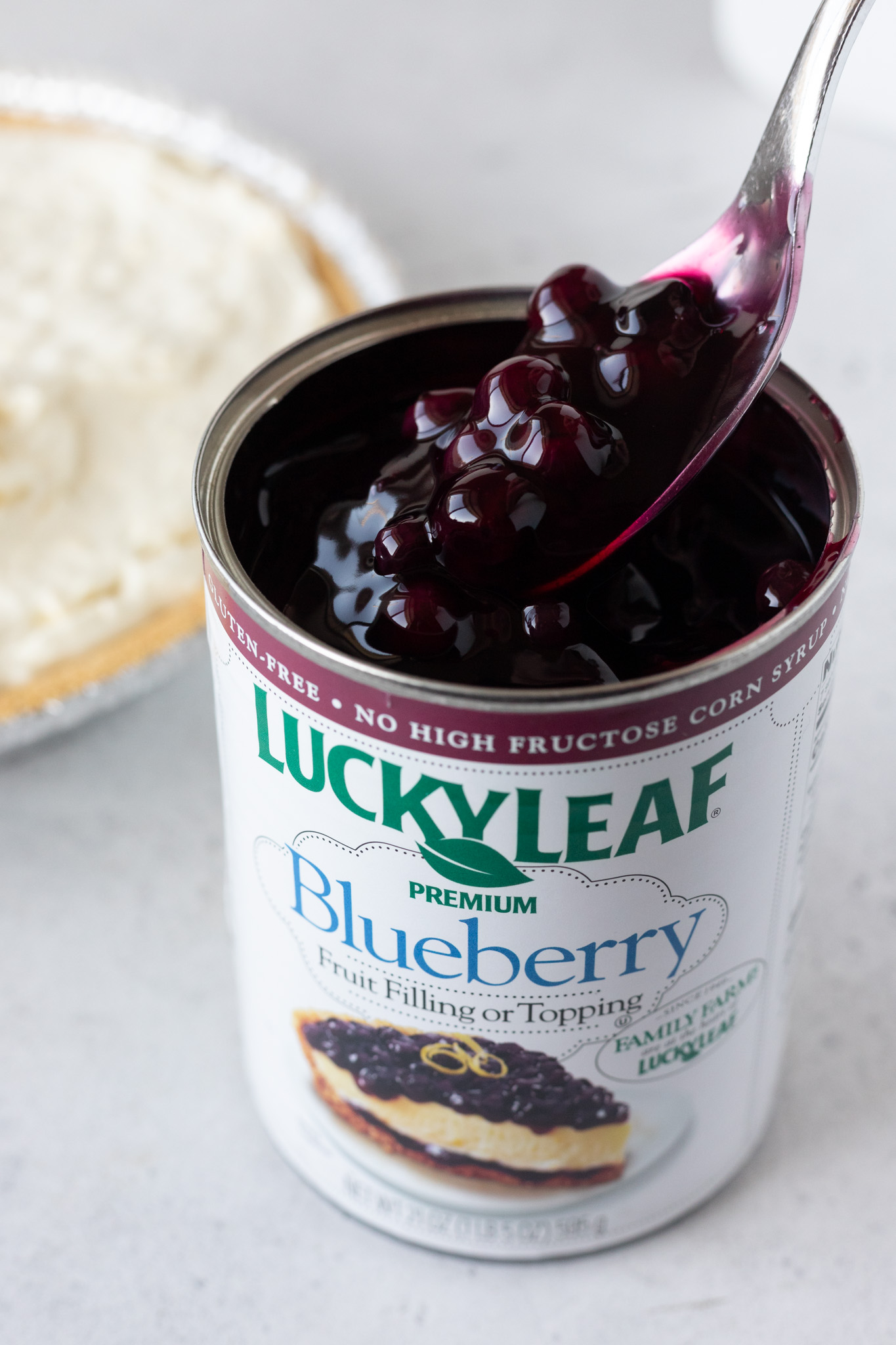 spoon scooping blueberry topping