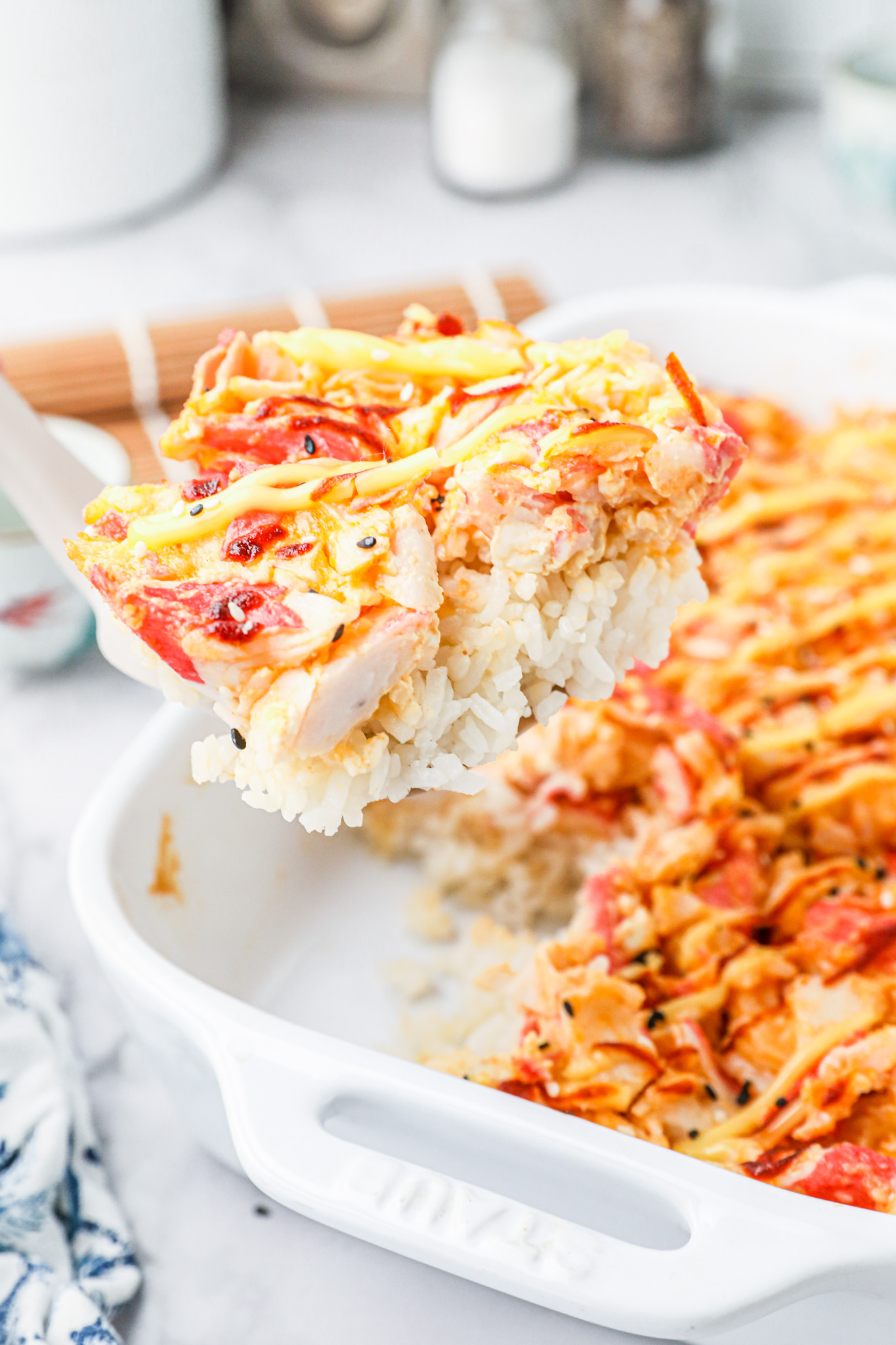 spatula scooping slice of casserole