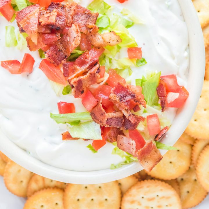 dip topped with bacon lettuce ands tomato