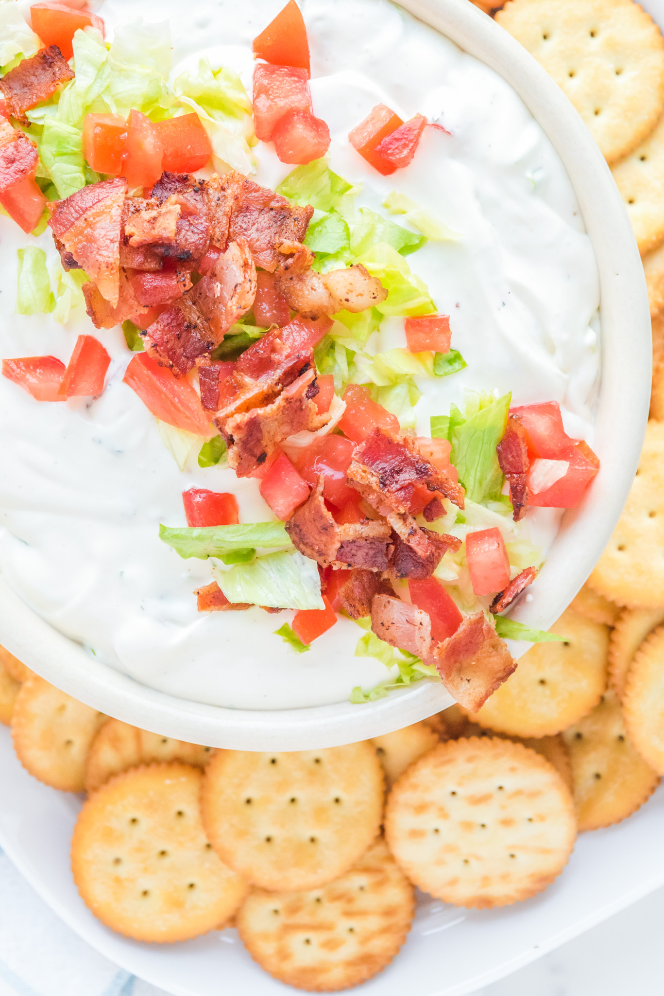 dip topped with bacon lettuce ands tomato