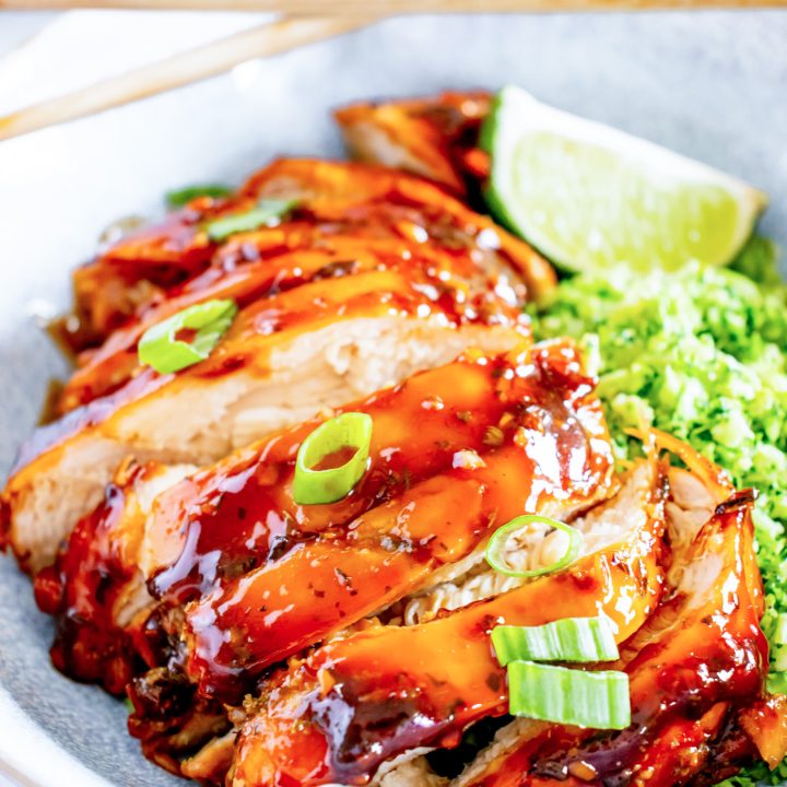 sliced chicken with an orange brown glaze