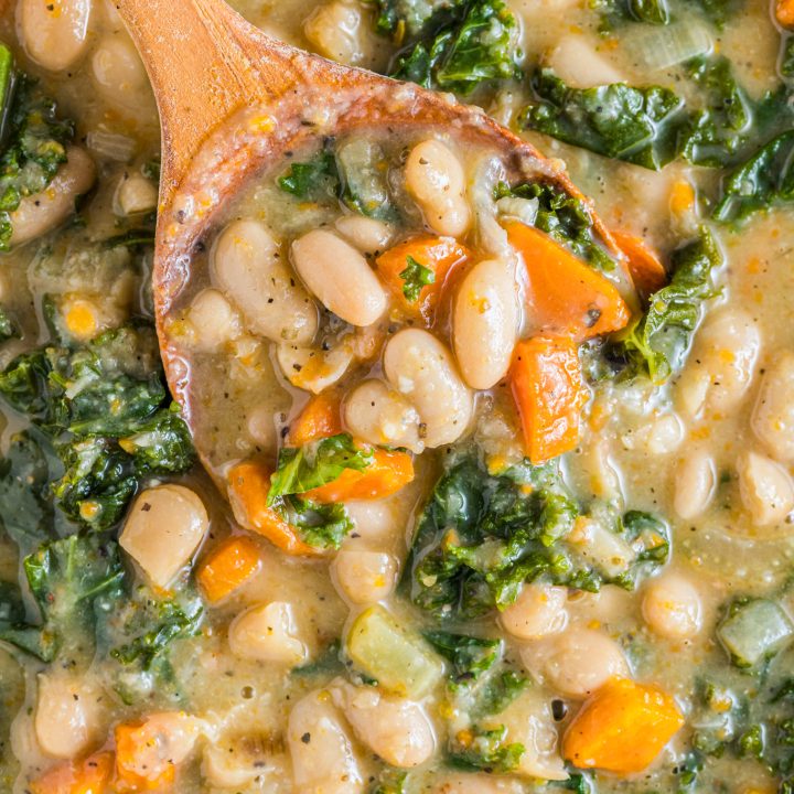 wooden spoon in bean soup