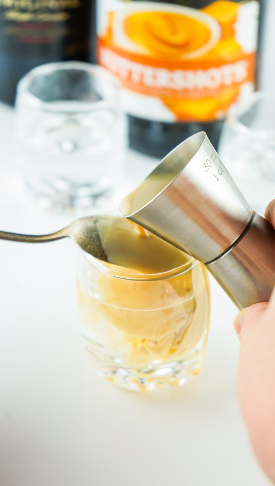 pouring Baileys over spoon