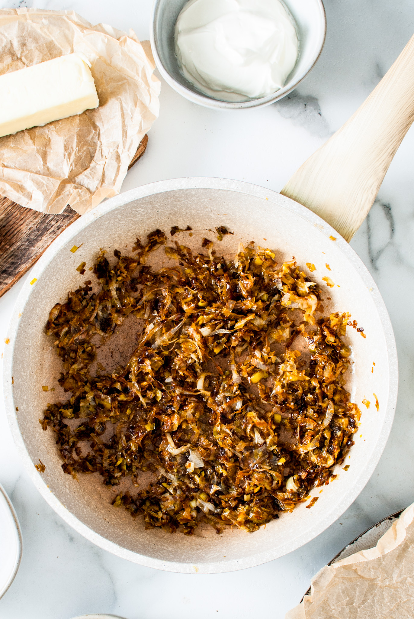browned cooked leeks in pan