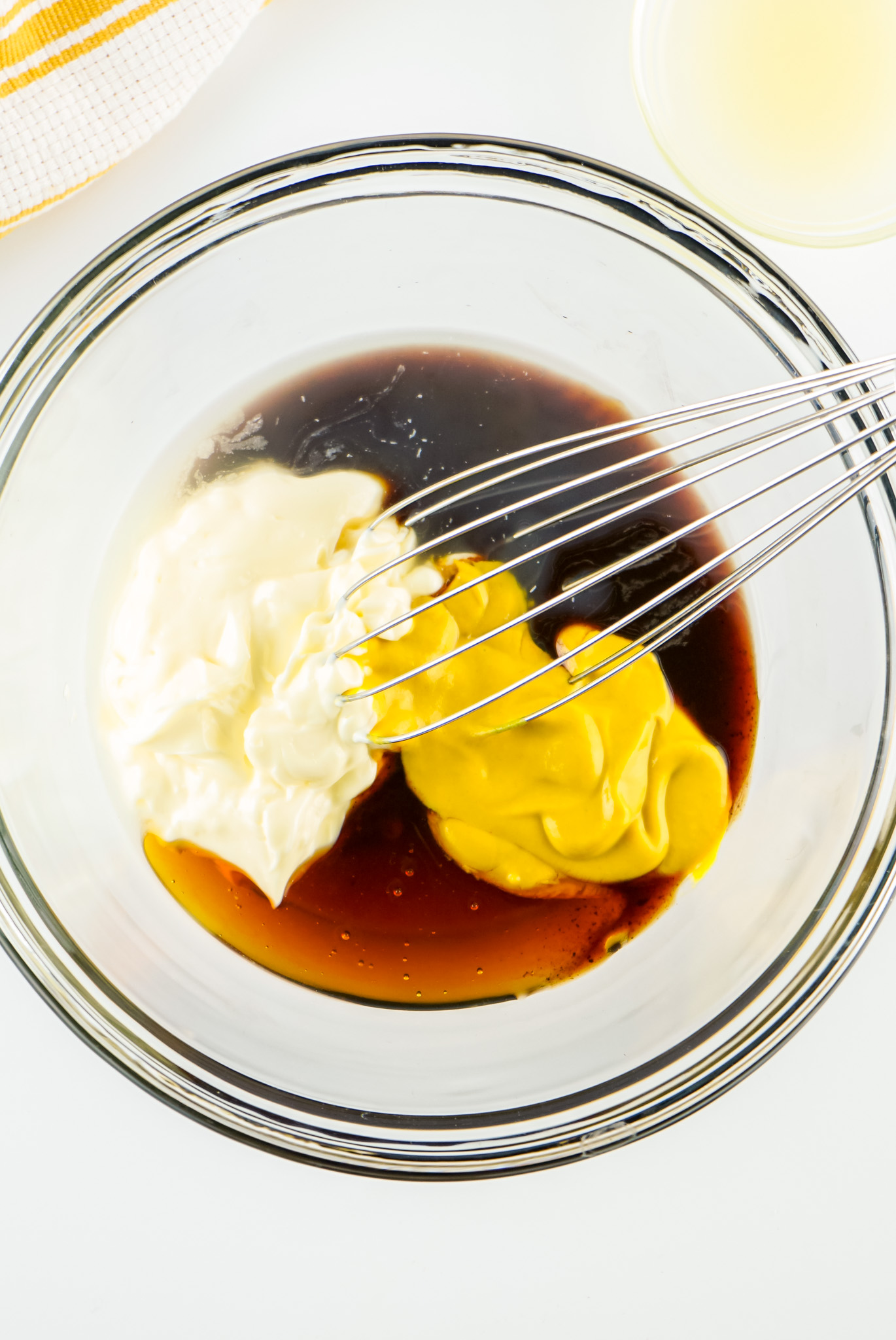 ingredients in bowl with whisk 