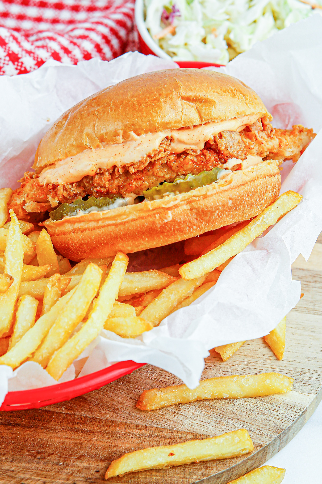chicken sandwich in basket with fries