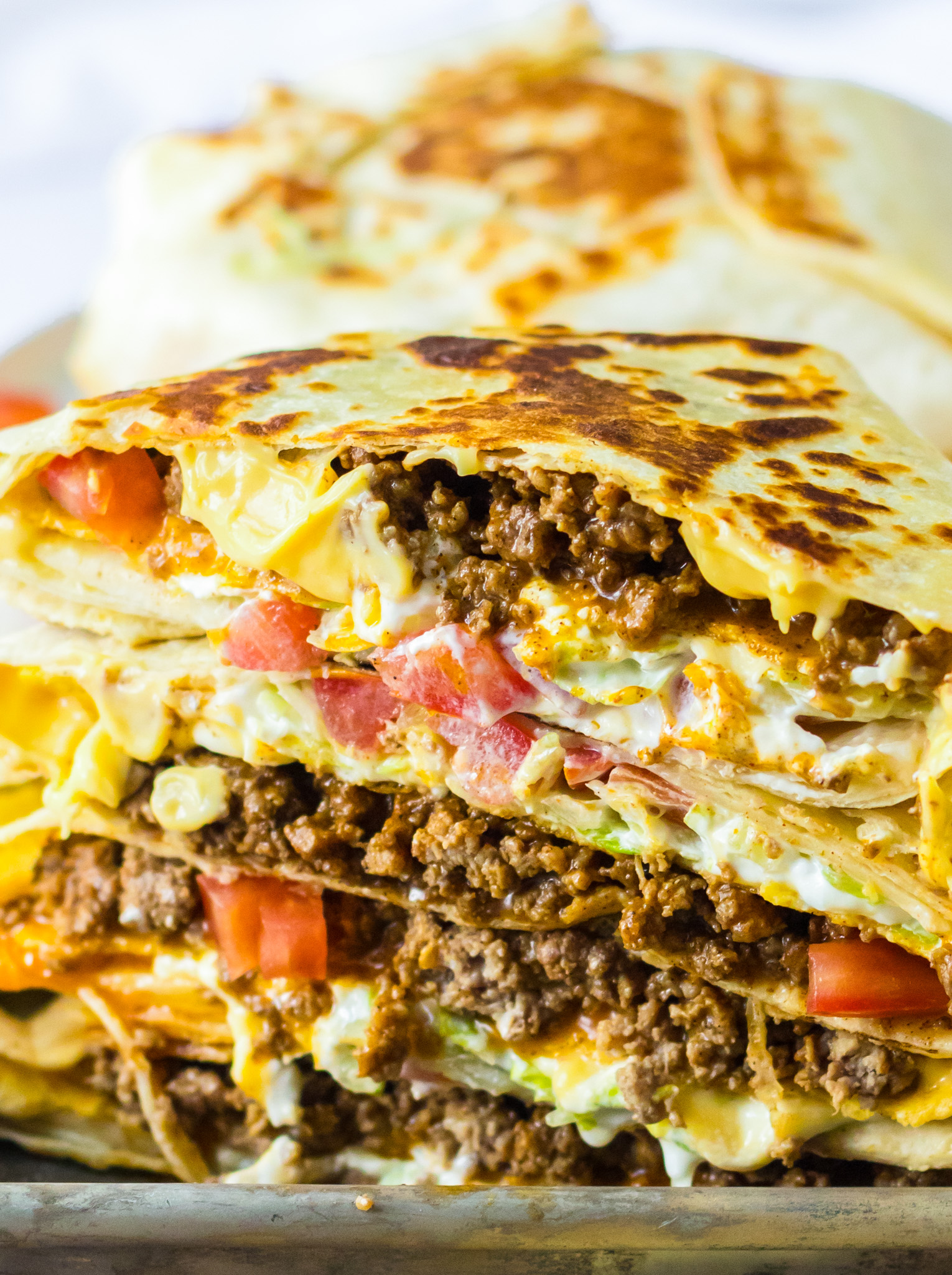 prepared Crunchwraps sliced and stacked