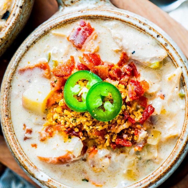 creamy soup topped with bacon and jalapeno slices
