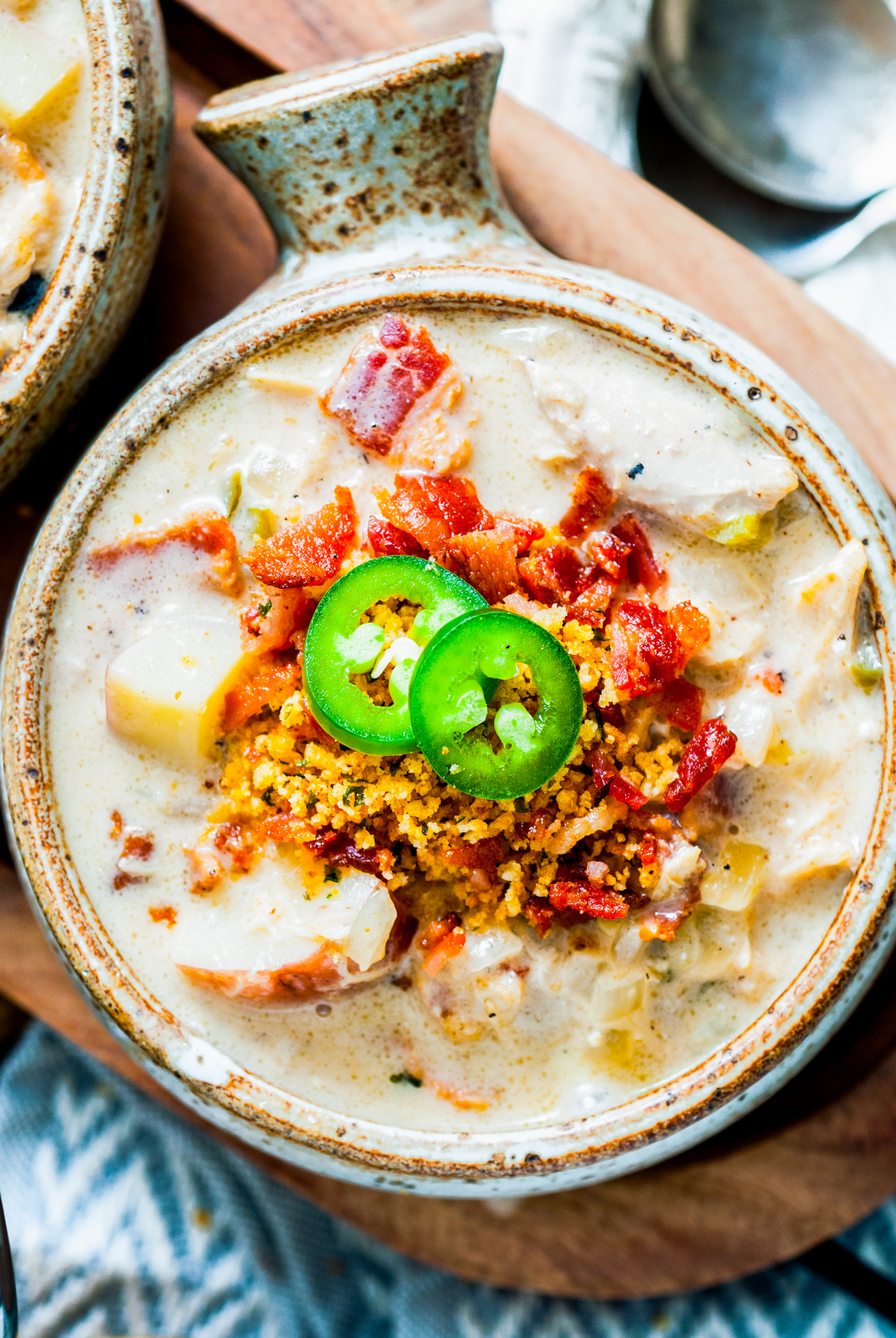 creamy soup topped with bacon and jalapeno slices