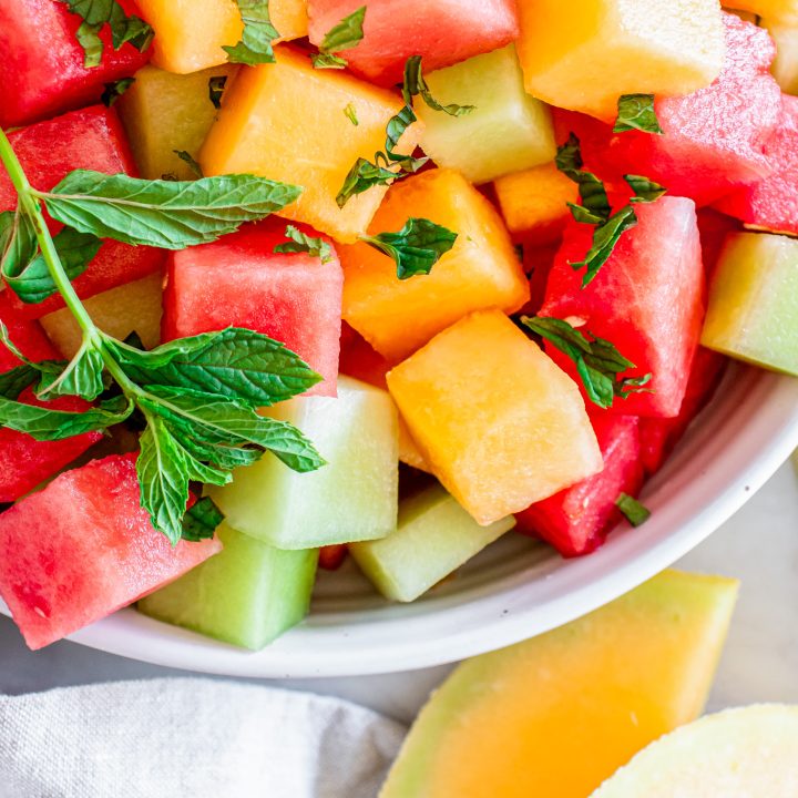 different color melon cubes with mint