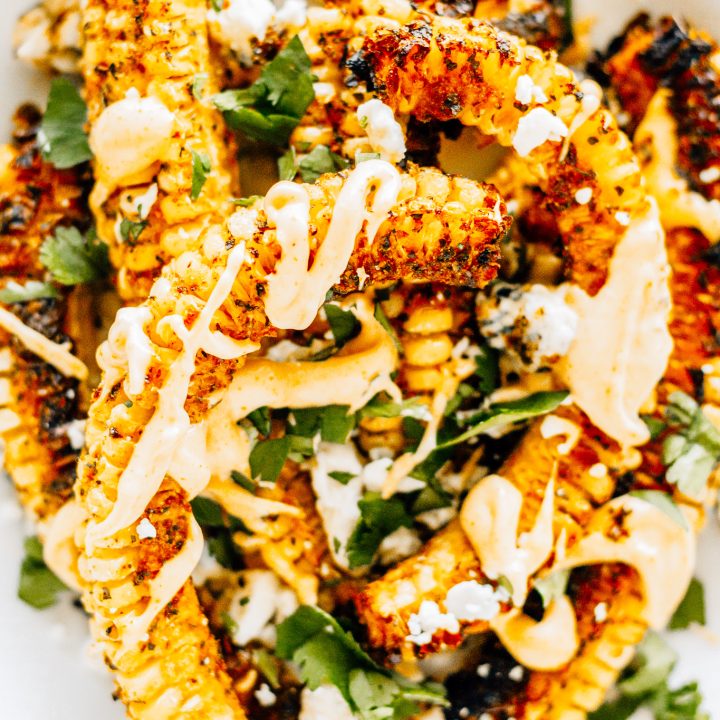 prepared corn drizzled with sauce