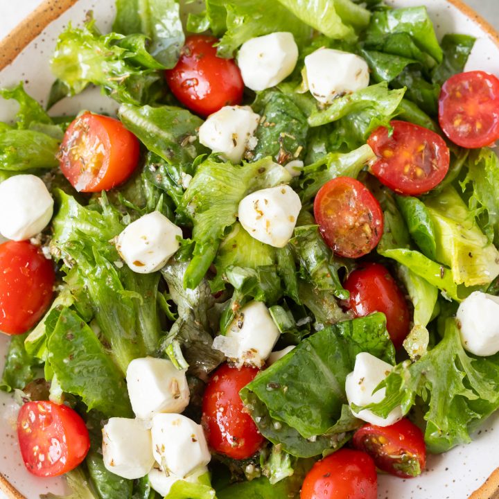 lettuce, mozzarella, basil and tomatoes in bowl