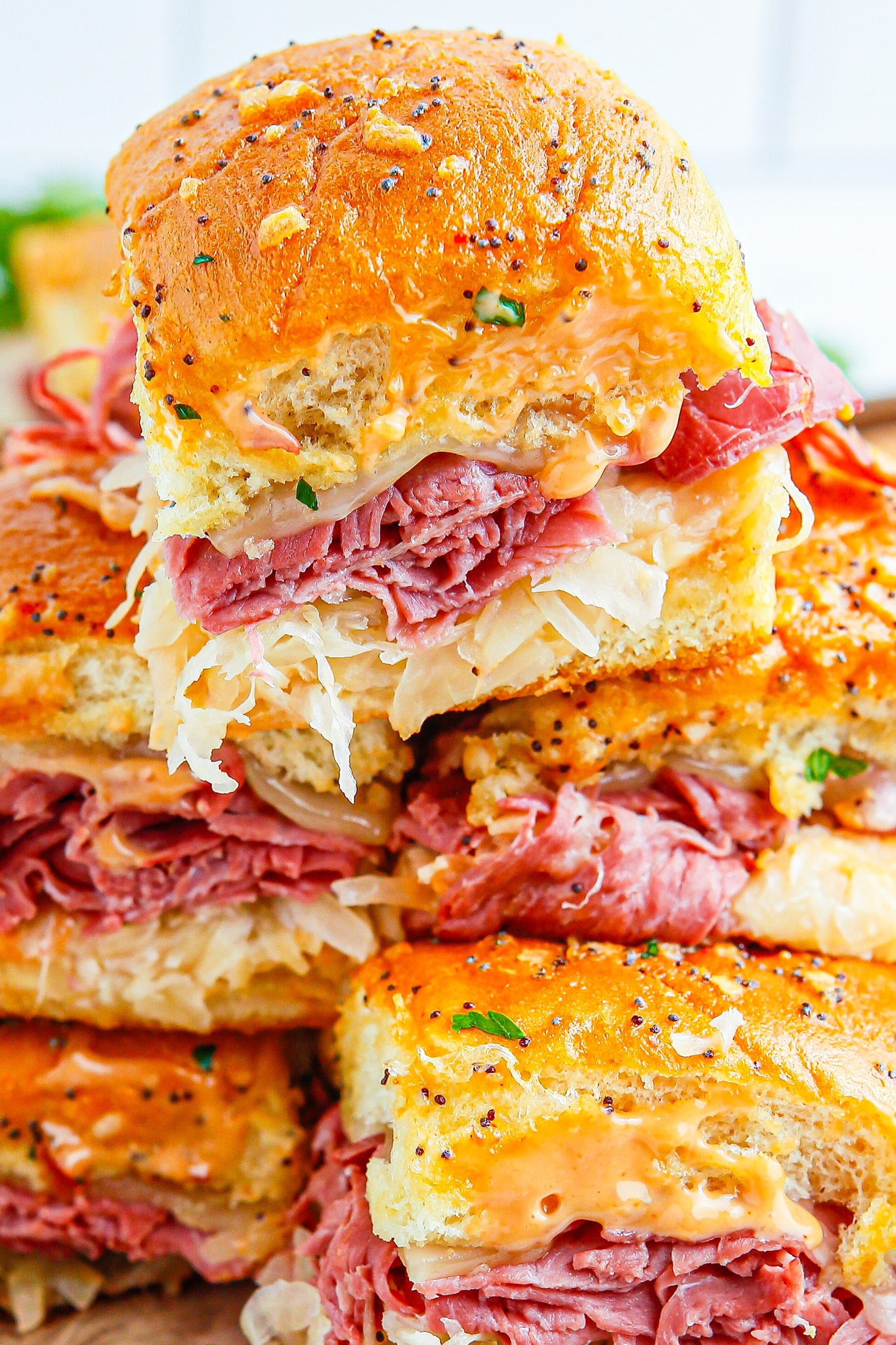 baked sliders in a stack