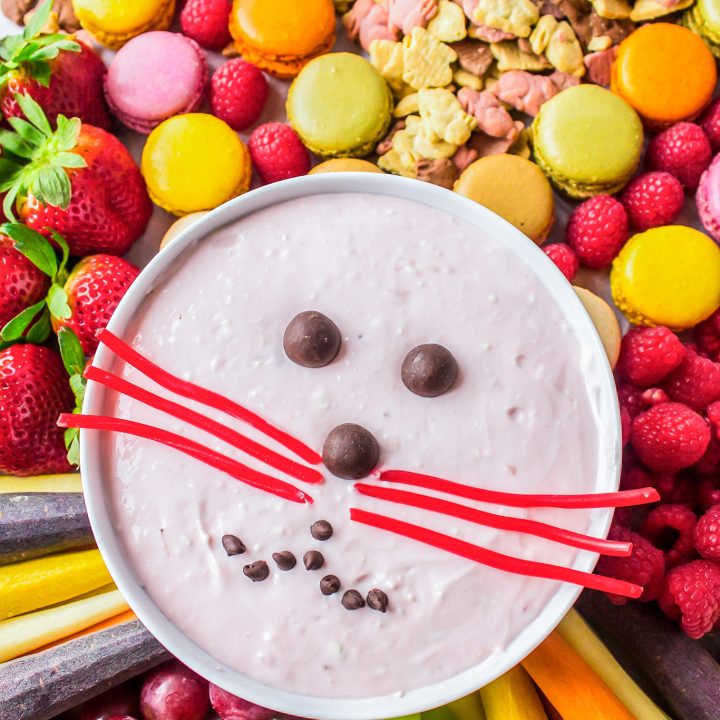 sweets and fruit surrounding bunny face fruit dip
