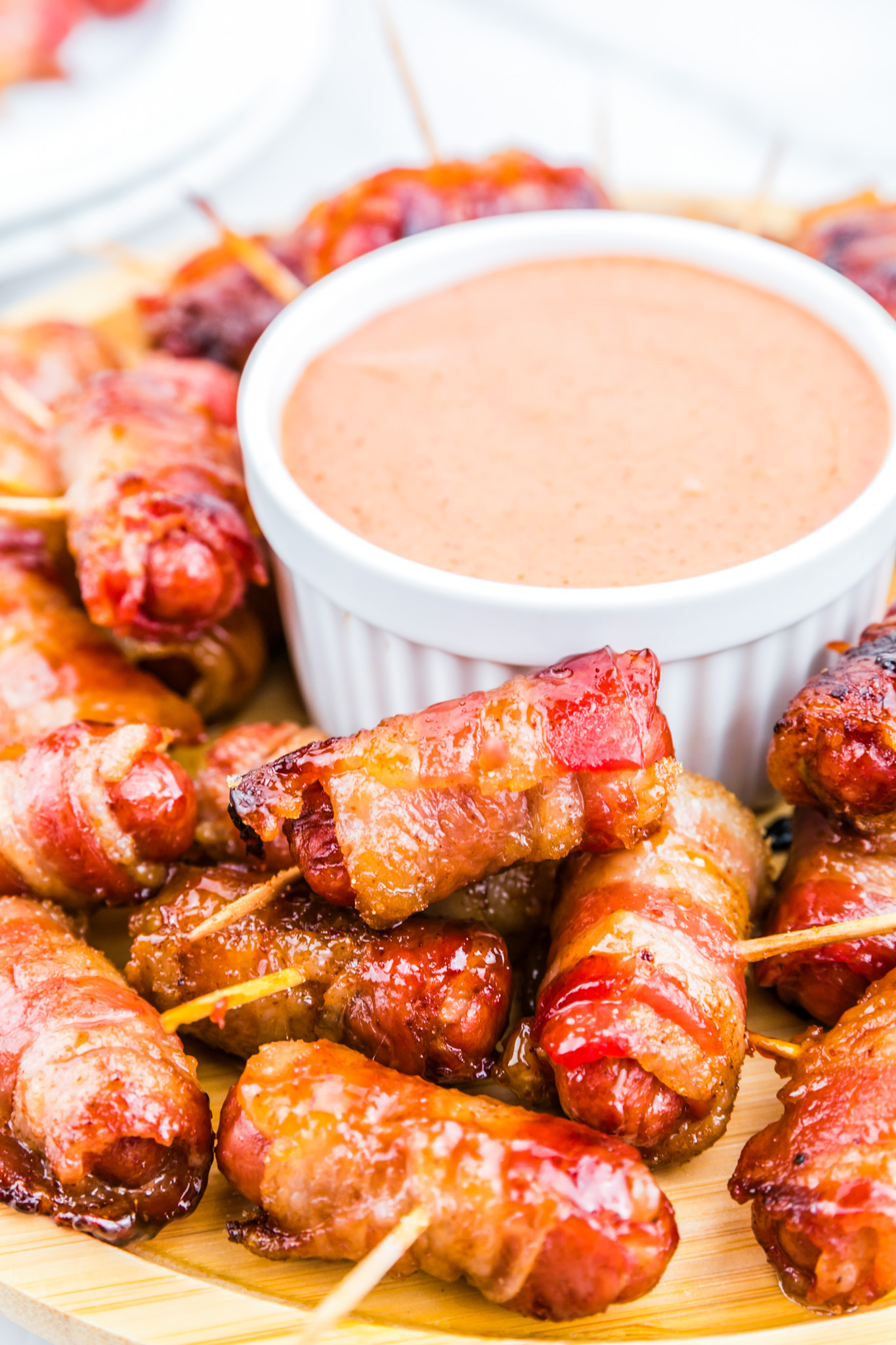 prepared smokies in bacon served with spicy mayo dip