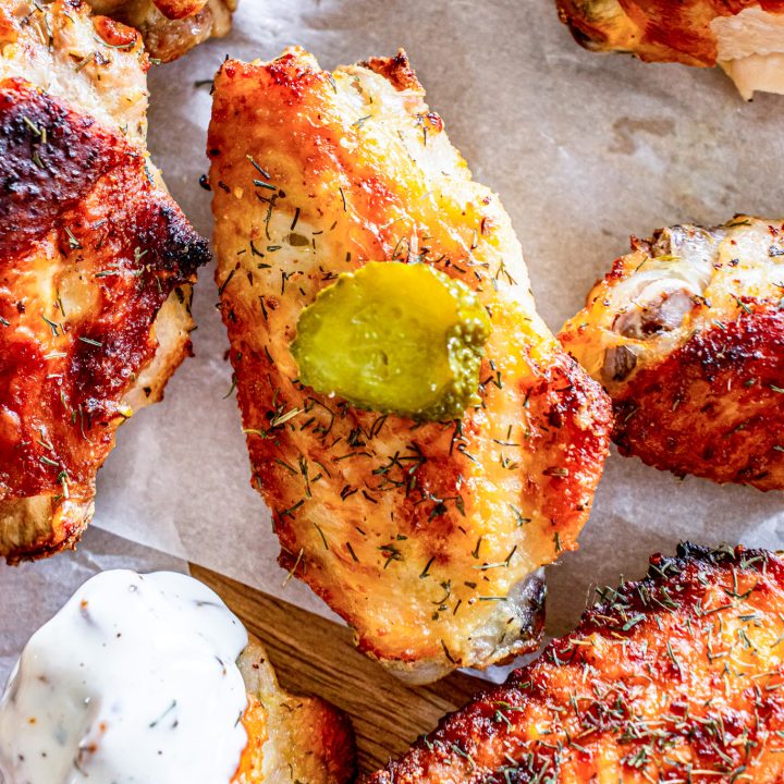 chicken wing topped with sliced pickle