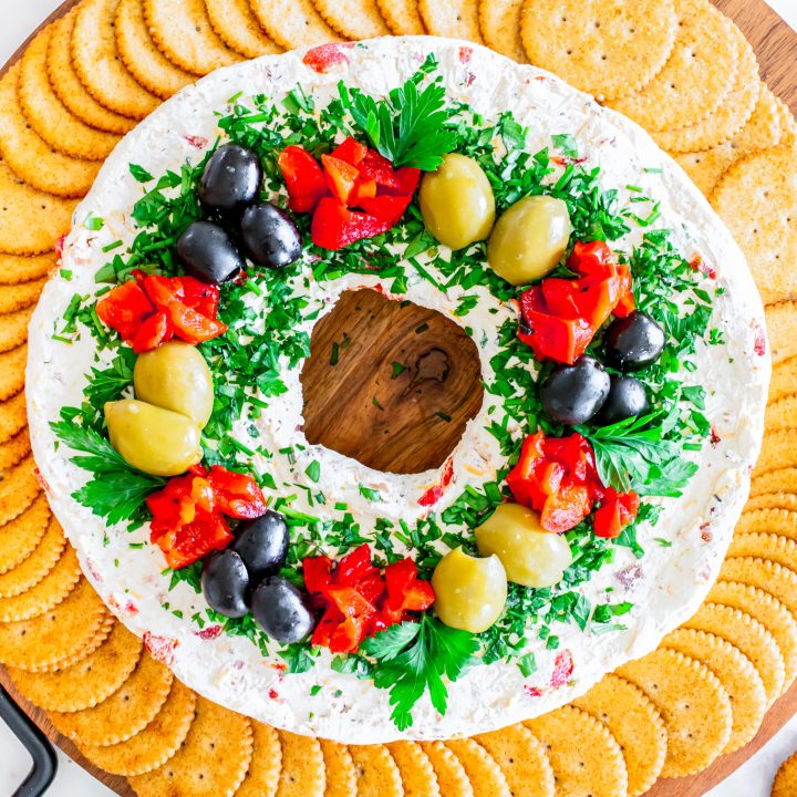 wreath shaped cheese ball surrounded by crackers