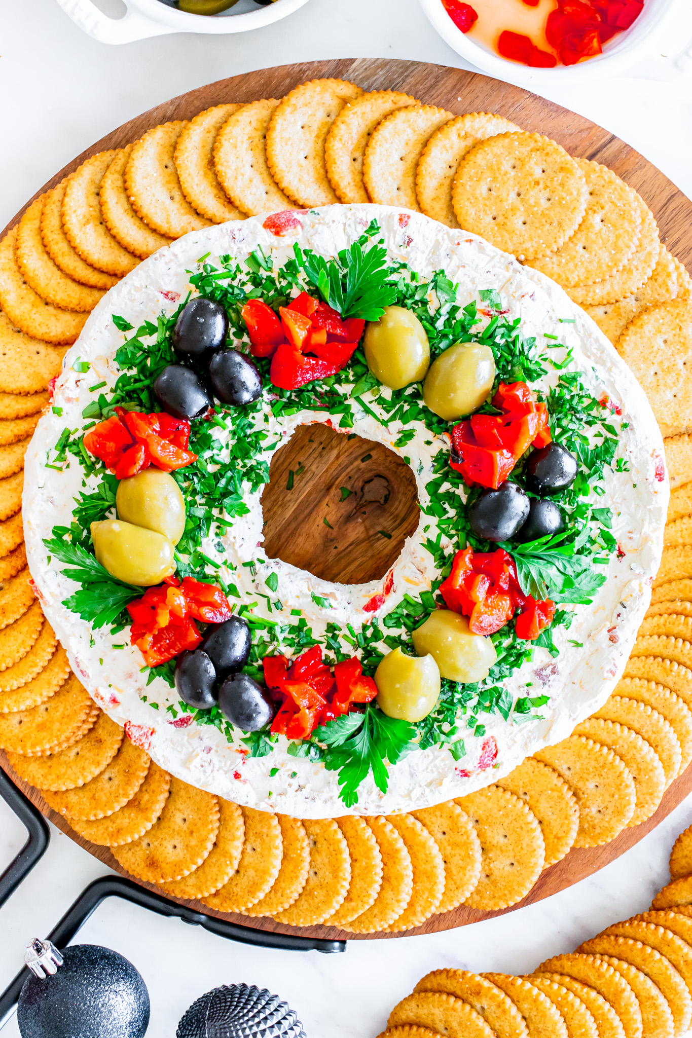 wreath shaped cheese ball surrounded by crackers