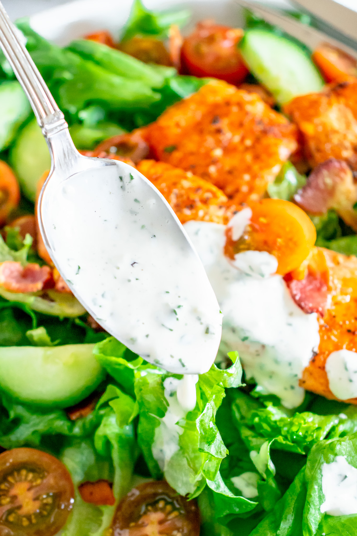 ranch dressing dripping off spoon