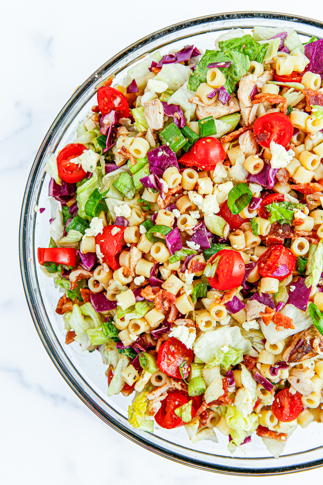 prepared salad in clear glass bowl