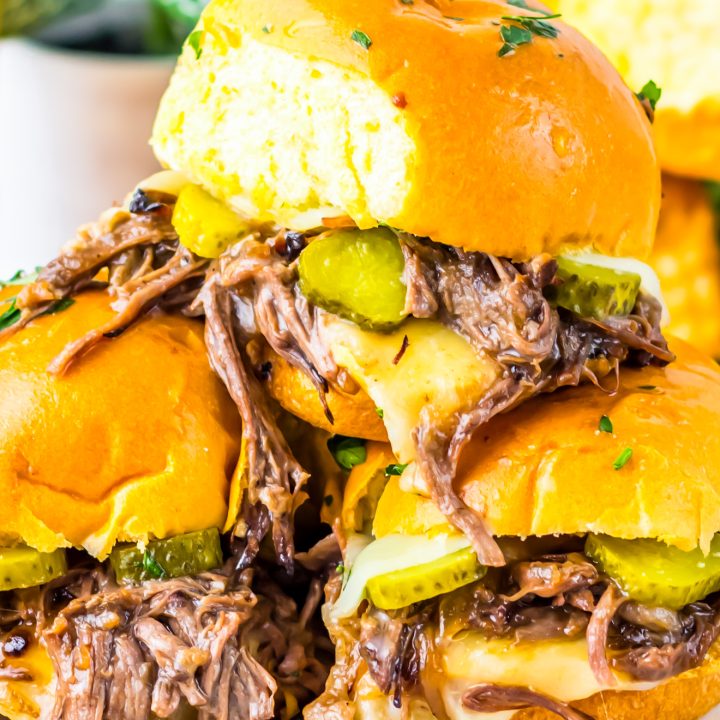 prepared sandwiches stacked on plate