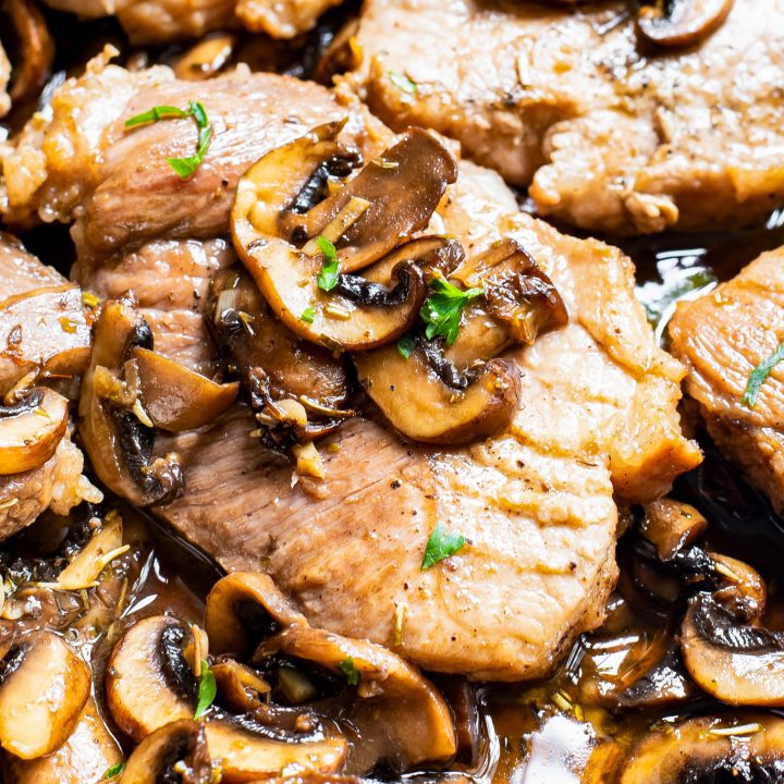 cooked pork topped with mushrooms