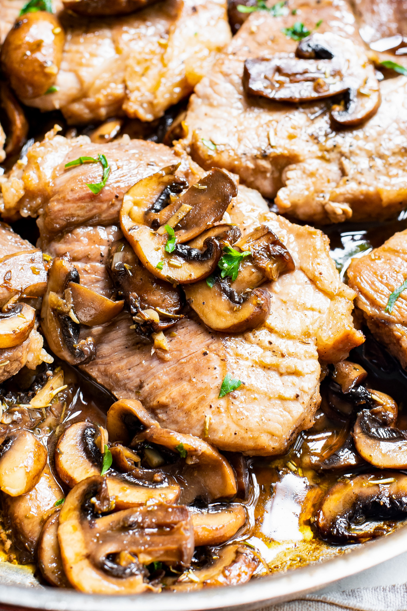 cooked pork topped with mushrooms