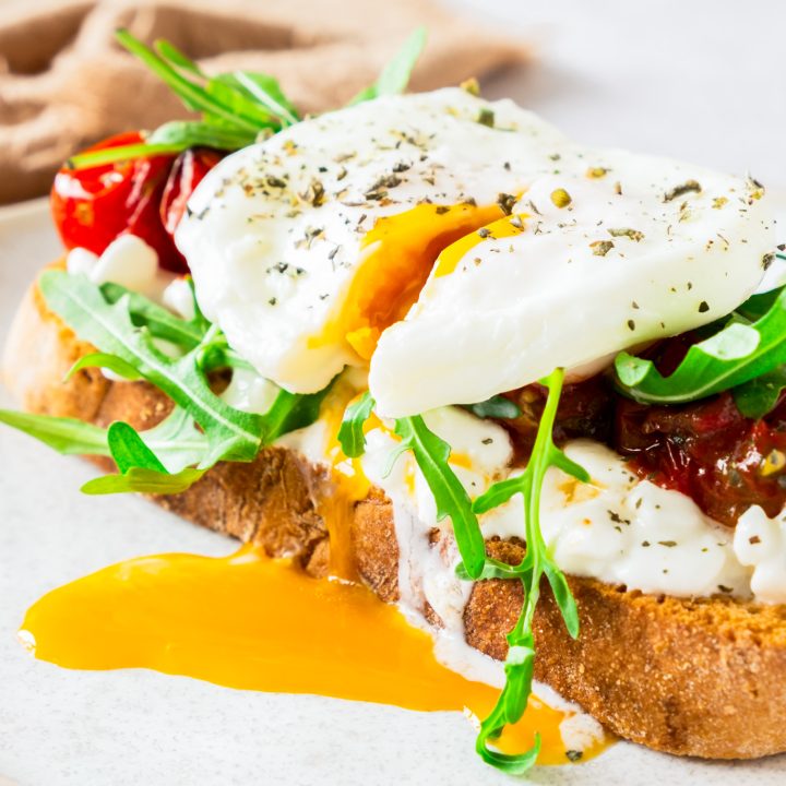 toast topped with egg and dripping yolk