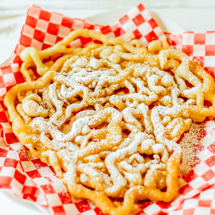 funnel cake topped with powdered sugar