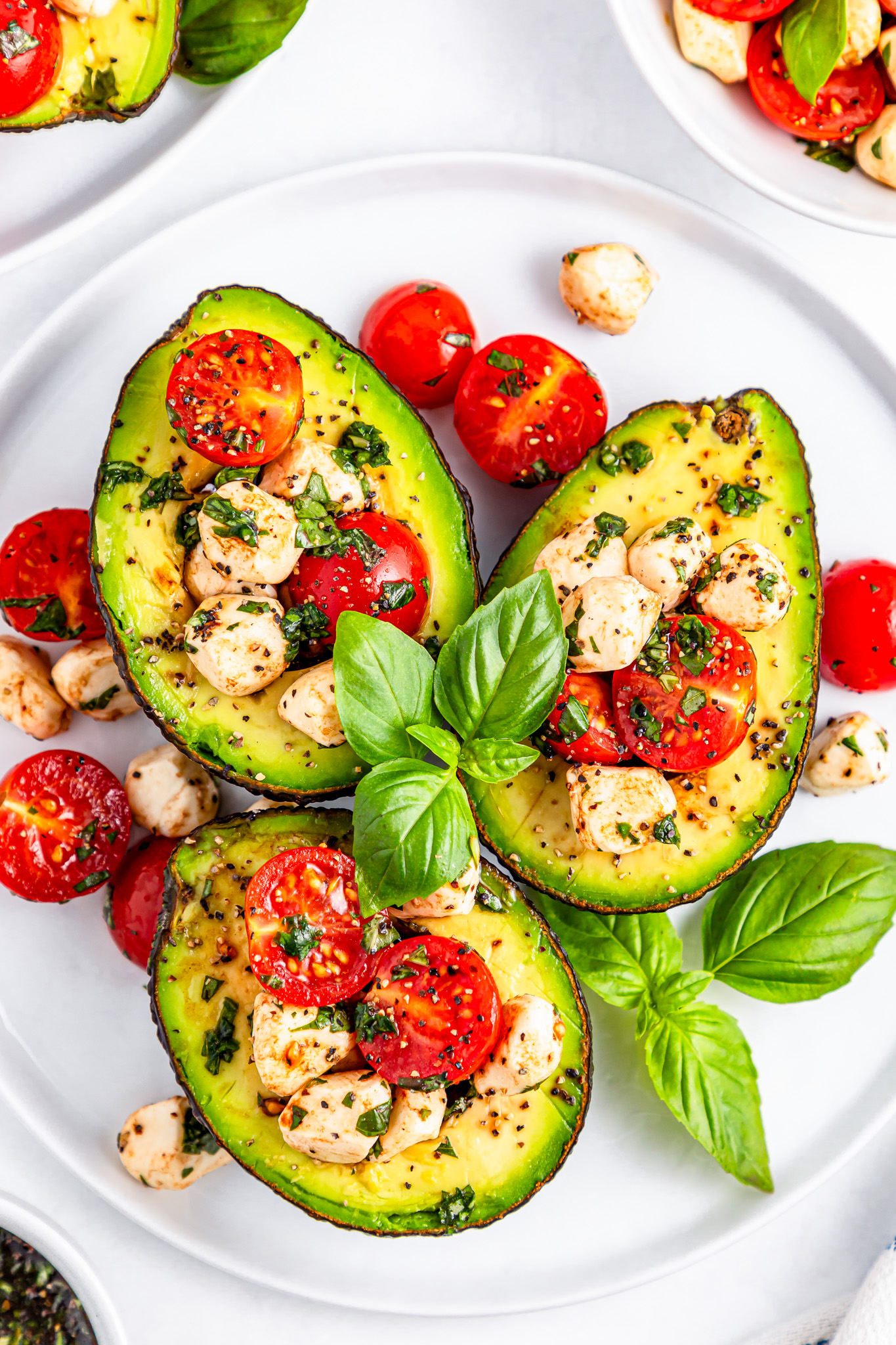 prepared avocados on white plate
