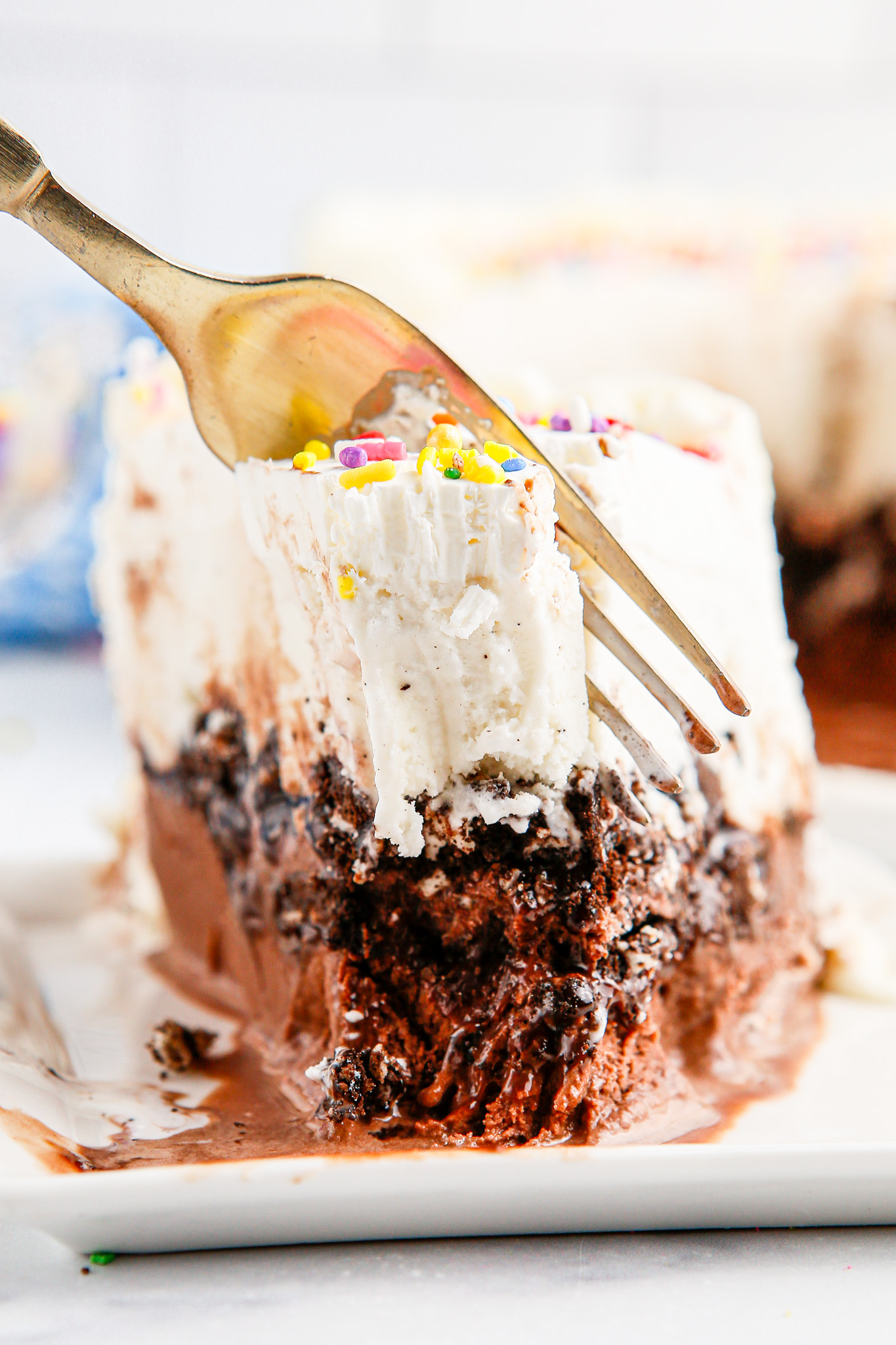fork taking bite from cake slice