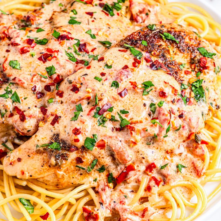 chicken and sauce over pasta